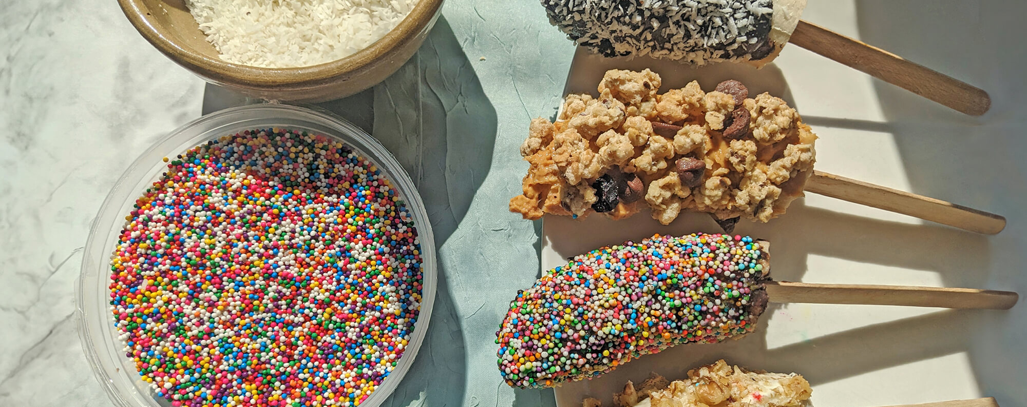 frozen banana pops with toppings