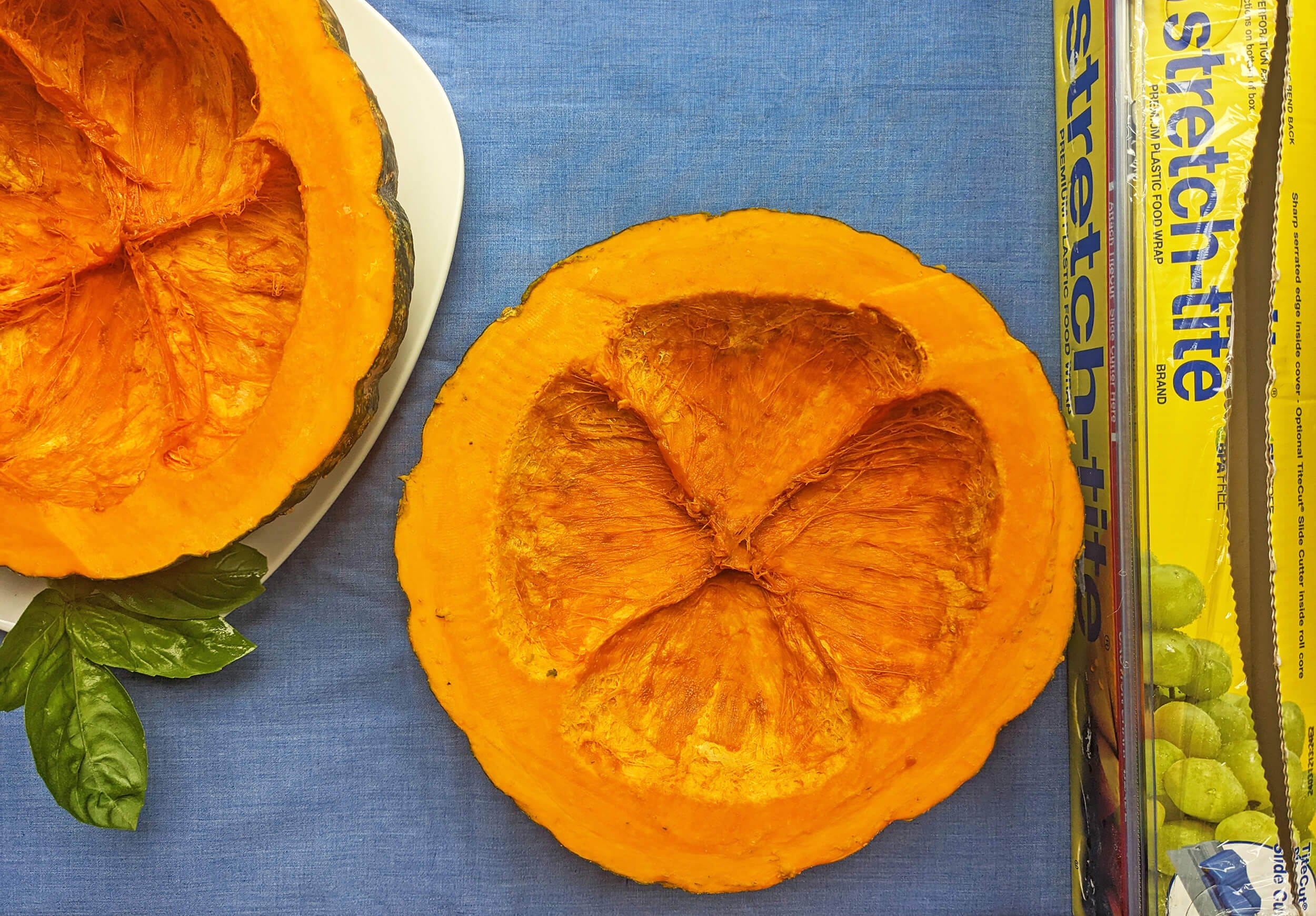 scooping squash out to add stuffing